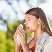 beautiful-woman-using-tissue-while-sneezing