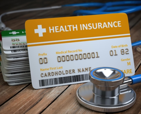 health-care-medical-insurance-card-stethoscope-as-symbol-medicine-wood-background