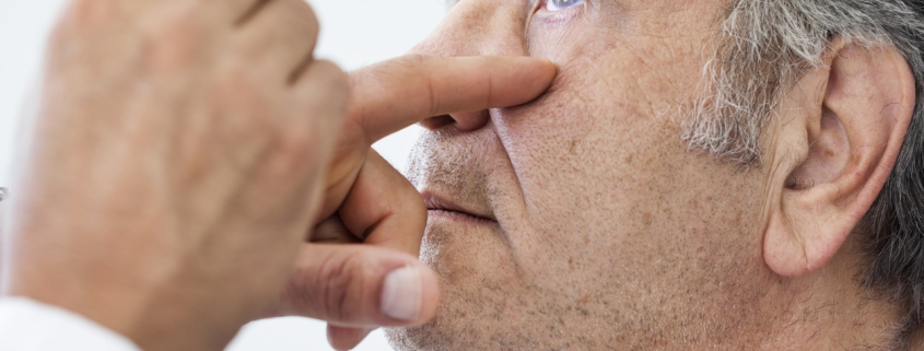 Elderly man examined by an ophthalmologist